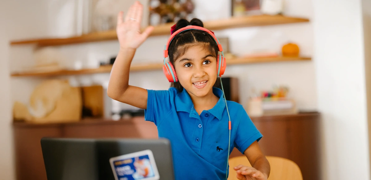 girl student in class raising her hand